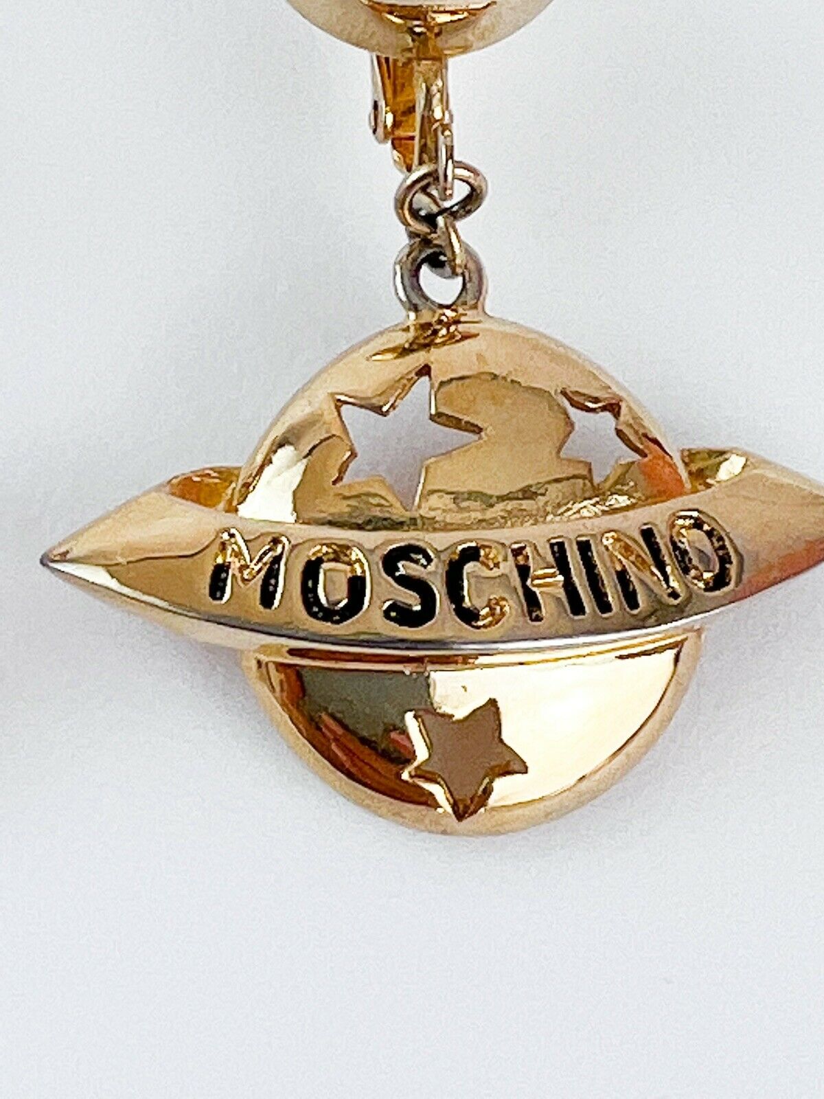 Moschino Vintage Star Saturn Planet Dangle Earrings Gold Tone Logo