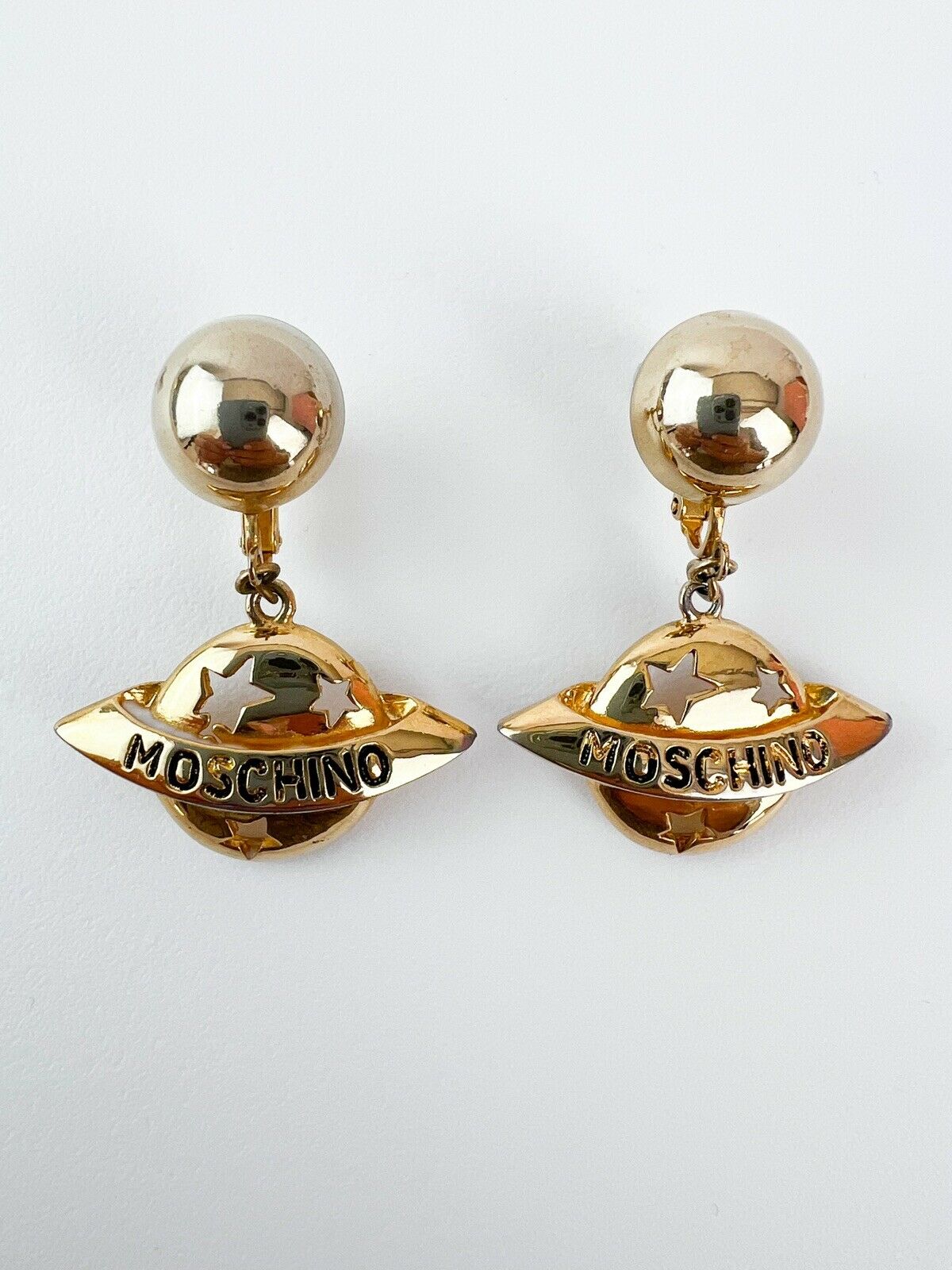 Moschino Vintage Star Saturn Planet Dangle Earrings Gold Tone Logo